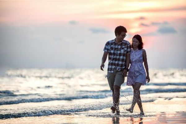 couple walking on beach couple walking on beach